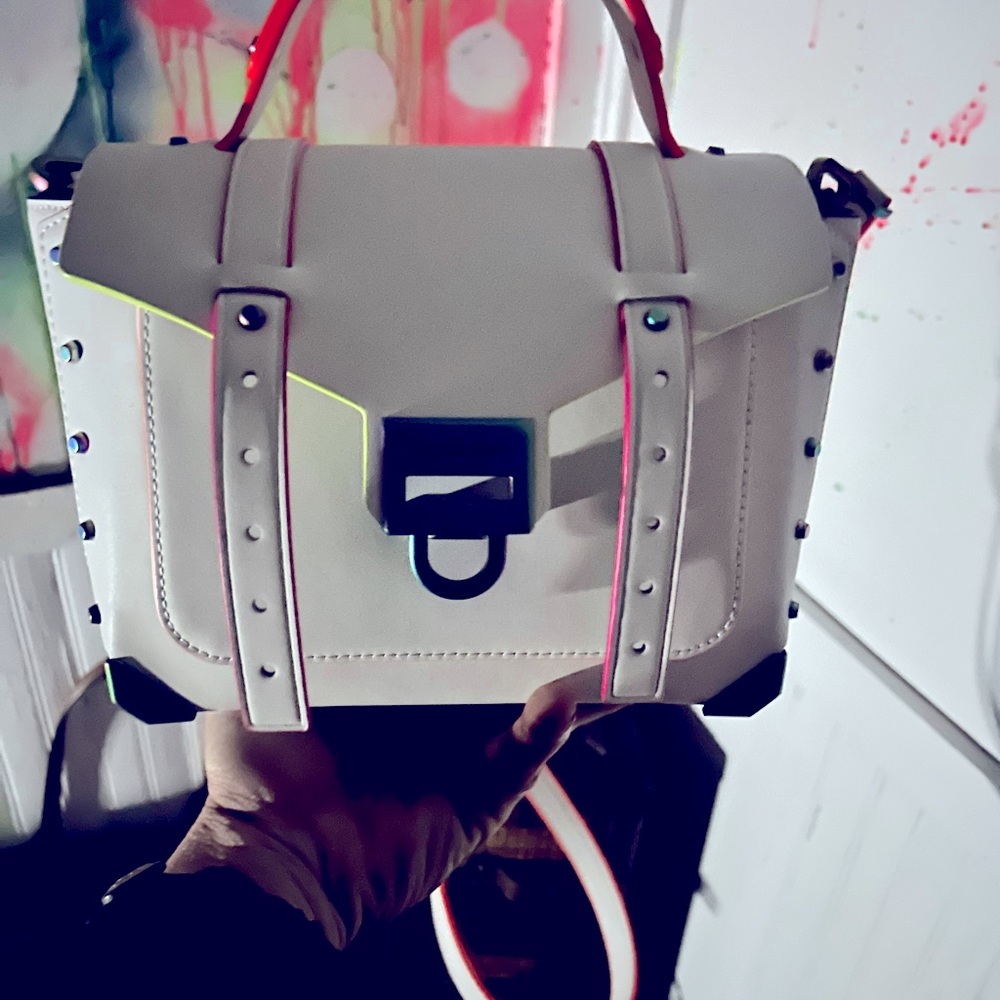 This is a Michael Kors Manhattan Medium Satchel. It has never been used.